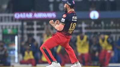 Royal Challengers Bangalore's Virat Kohli celebrates after the dismissal of Lucknow Super Giants' Marcus Stoinis. AFP