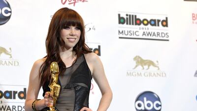 Carly Rae Jepsen poses backstage the award for top digital song for "Call Me Maybe". John Shearer / Invision / AP