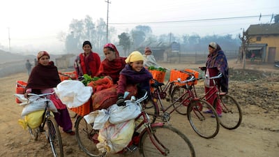 Women bring vegetables for sale to a market in Birendranagar, in Surkhet district of Nepal, on cycles donated by a foreign charity. Prakash Mathema / AFP / February 2, 2017