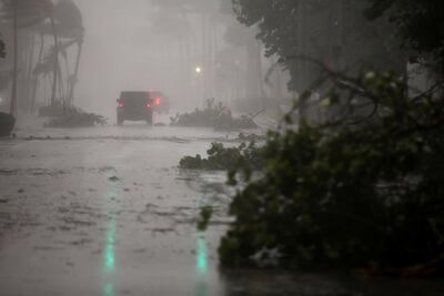 Vehicles drive along Ocean Drive in South Beach as Hurricane Irma hits south Florida on September 10, 2017. Carlos Barria / Reuters