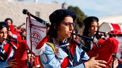 Palestinian scout troops perform during a parade ahead of the arrival of the Relic of the Holy Crib of the Child Jesus. AFP