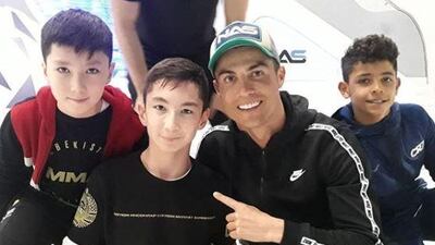Ali and Ronaldo pose for a photo after a knockabout in Dubai. Ali Turganbekov / Instagram