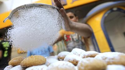 A baker makes traditional sweets in Cairo. Mohamed Abd El Ghany / Reuters