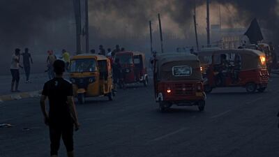 Young tuk-tuk drivers wait to carry wounded protests to transfer them to hospitals during anti-government protests in Baghdad, Iraq. REUTERS