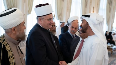 Sheikh Mohamed bin Zayed greets delegates from the International Muslim Communities Congress on Monday. Hamad Al Kaabi / Crown Prince Court - Abu Dhabi