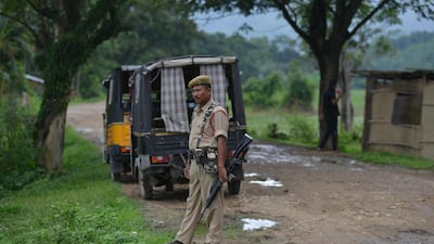 Indian security personnel near the site of the lynching of two men in Panjuri Kachari village on July 10. AFP