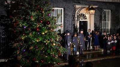 Mr Sunak and his wife outside No 10 as the Christmas lights are turned on. Getty Images