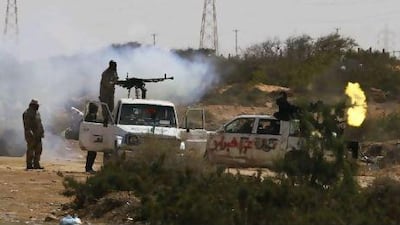 Rebels fire in pursuit of government troops east of Sirte in eastern Libya yesterday.