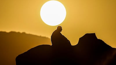 A pilgrim prays at dawn on Mount Arafat during the Hajj pilgrimage on Saturday. Temperatures in Makkah climbed to 51.8°C this year. AFP