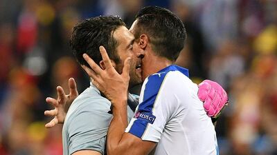 Italy forward Graziano Pelle (R) celebrates with Italy’s goalkeeper Gianluigi Buffon after scoring during the Euro 2016 group E football match between Belgium and Italy at the Parc Olympique Lyonnais stadium in Lyon on June 13, 2016. Vincenzo Pinto / AFP