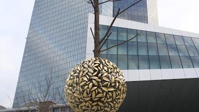 Exterior of the European Central Bank building, and in the foreground Gravity and Growth by Guiseppe Penone. Ulrich Baumgarten / Getty Images