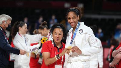 Head coach Dawn Staley of the United States with A'ja Wilson with her gold medal.