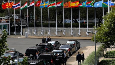 Flags fly above diplomatic vehicles on the first day of high-level meeting at United Nations headquarters. EPA