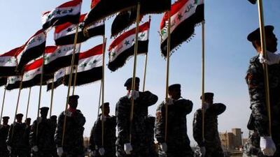 **RETRANSMISSION FOR IMPROVED QUALITY** Iraqi policemen march with the Iraqi country during their graduation ceremony at the town camp in Numaniyah, 120 kilometers (80 miles) southeast of Baghdad, Iraq, Monday, Jan. 21, 2008. 45 policemen finished their training and will return back to their base in Ramadi to start their duty. (AP Photo/ Loay Hameed)