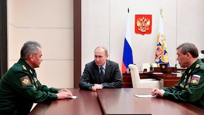 Russian President Vladimir Putin, (C) Russian Defense Minister Sergey Shoigu (L) and Chief of the General Staff of the Russian Armed Forces Valery Gerasimov during a meeting in Moscow, Russia on April 20, 2018. Alexei Nikolsky / AP