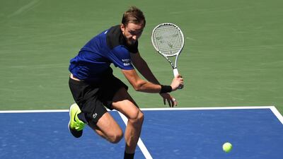 Daniil Medvedev chases down the ball against JJ Wolf during the US Open third round. Reuters