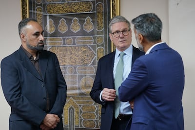 Prime Minister Keir Starmer with Jehangir Malik, member of the mosque management team, and Sohail Hasani, founding trustee of the mosque and community centre, during a visit to The Hub, Solihull Mosque, in Solihull. PA