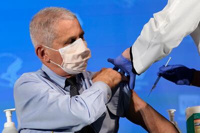 Dr. Anthony Fauci, director of the National Institute of Allergy and Infectious Diseases, prepares to receive his first dose of the COVID-19 vaccine. AP