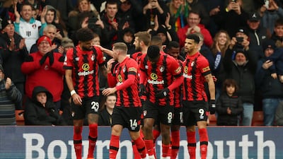 Philip Billing celebrates with teammates after putting Bournemouth ahead. Getty