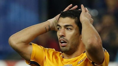 Barcelona’s Luis Suarez looks dejected during his team’s loss to Atletico Madrid. Reuters / Sergio Perez