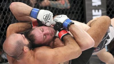 Tarek Suleiman (black shorts) fights Steve Kennedy in the middleweight division. Chris Whiteoak / The National