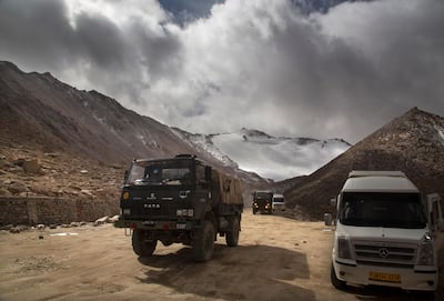 An Indian army vehicle crosses Chang La pass near Pangong Lake in Ladakh. AP