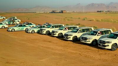 Saudi police vehicles wait near the airport in Al Ula to escort the national delegation to the Gulf Cooperation Council summit. AFP