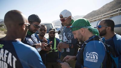 Dr Al Suwaidi stops to take photos with Saudis who cheered him on at the border of Makkah.