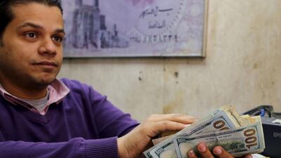 Efforts by the Egyptian central bank to bolster the local currency against the US dollar have created black markets in foreign currency and harmed investment, economists say. Asmaa Waguih / Reuters