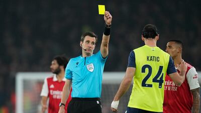 Zurich's Nikola Katic is shown a yellow card by referee Erik Lambrechts. AP