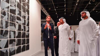 Sheikh Abdullah bin Zayed speaks to artists and curators at the Abu Dhabi Art exhibition. Wam