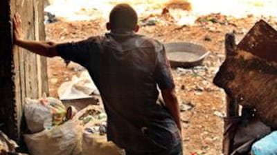 A member of the Zabaleen community stands in his family's empty pig pen.