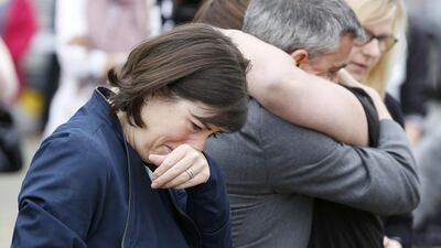 Labour MPs, left to right, Lucy Powell, Paula Sheriff, Jeff Smith, and former Labour Party councillor Karen Rowling, read tributes near the scene of the murder of Labour Member of Parliament Jo Cox in Birstal near Leeds, Britain. Craig Brough / Reuters