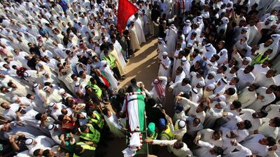 Mourners carry the body of one of the victims of the Al Imam Al Sadeq mosque bombing, during a mass funeral at Jaafari cemetery in Kuwait City on June 27, 2015. Yasser Al Zayyat/AFP Photo
