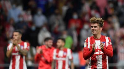 Atletico Madrid's French midfielder Antoine Griezmann celebrates. AFP