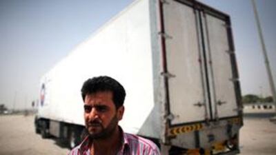 Waiting to cross into Saudi Arabia at Al Ghuwaifat, Ali Khawata says border delays are expected and give long-haul lorry drivers a chance to socialise.