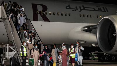 Evacuees from Afghanistan arrive at Hamad International Airport in Qatar's capital Doha on the first flight carrying foreigners out of the Afghan capital since the US withdrawal last month. AFP