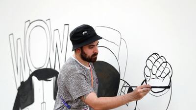 Rami Al Afifi creates artwork at Burj Park.