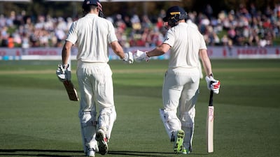 England's Mark Stoneman (R) and teammate Alastair Cook walk onto the field during the second cricket Test match between New Zealand and England at Hagley Oval in Christchurch on March 30, 2018. Marty Melville / AFP