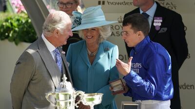 Prince Charles, the Prince of Wales, and Camilla, the Duchess of Cornwall, present The St James's Palace Stakes trophy to jockey William Buick after his victory on Coroebus at Royal Ascot. PA