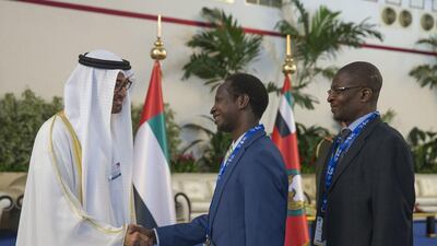 Sheikh Mohammed bin Zayed Al Nahyan, Crown Prince of Abu Dhabi and Deputy Supreme Commander of the Armed Forces, greets a guest during the opening of the Dubai Airshow. Mohammed Al Hammadi / Crown Prince Court - Abu Dhabi
