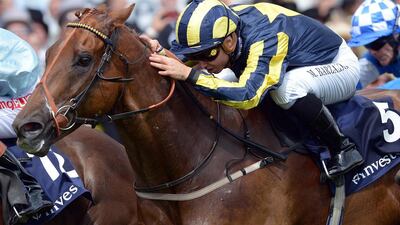Mickael Barzalona rides Addictive Dream in the Specialist Bank ‘Dash’ on Derby Day at the Epsom Derby Festival, in Surrey, southern England, on June 7, 2014. Carl Court / AFP