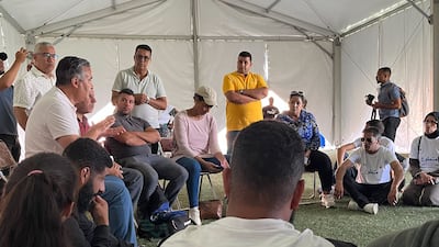 Volunteers at the shelter for earthquake survivors in Marrakesh during an internal meeting. Ghaya Ben Mbarek / The National