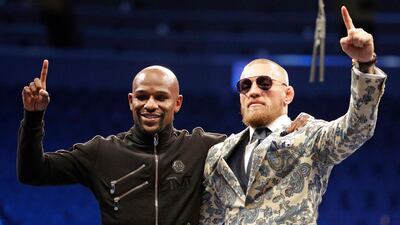 Floyd Mayweather Jr, left, and Conor McGregor together after the post-fight press conference. Isaac Brekken / AP Photo