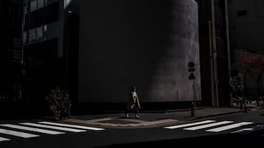 A woman walks at an intersection in the Chuo district of Tokyo. AFP