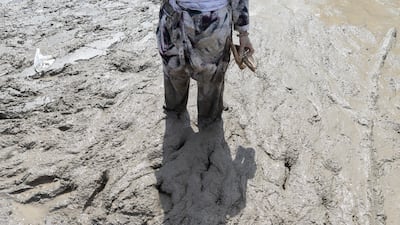 A flood survivor returns to home following a flash flood in Devighat Village, Nuwakot district, Nepal. EPA