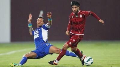 A 53rd-minute strike by Leonardo Lima, left, was not good enough for Al Nasr as Al Wahda came from behind to win tonight. Mike Young / The National