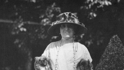 The American writer Edith Wharton photographed at home in France with her two pet dogs, sometime in the 1920s. Wharton was a devoted Francophile who surrounded herself with sometimes garish or sentimental French designs. Granger / REX / Shutterstock