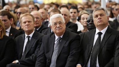 Palestinian president Mahmoud Abbas, centre, sits next to European Council president Donald Tusk, left, during the funeral of Shimon Peres in Jerusalem on September 30, 2016. Abir Sultan / Associated Press