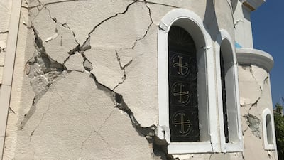 A crack sits in the facade of a church after an earthquake in Kos on the island of Kos, Greece Friday, July 21, 2017. Greek authorities said two tourists killed in the overnight quake are from Turkey and Sweden.(AP Photo/Michael Probst)